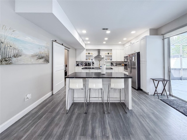 224 Hammock Dunes Pl, Orlando, FL 32828 - kitchen with appliances with stainless steel finishes, open shelves, wall chimney range hood, dark wood-type flooring, and recessed lighting