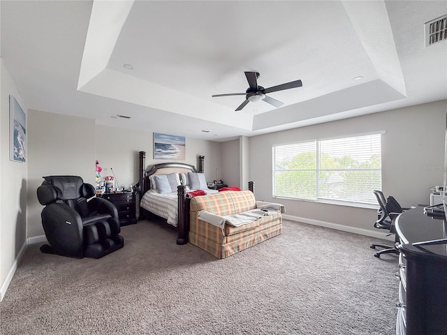 224 Hammock Dunes Pl, Orlando, FL 32828 - bedroom featuring a tray ceiling, carpet floors, and baseboards