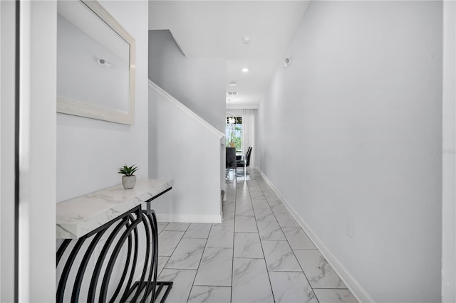 8961 Cabot Cliffs Dr, Davenport, FL 33896 - corridor featuring light marble finish flooring, baseboards, recessed lighting, and stairway