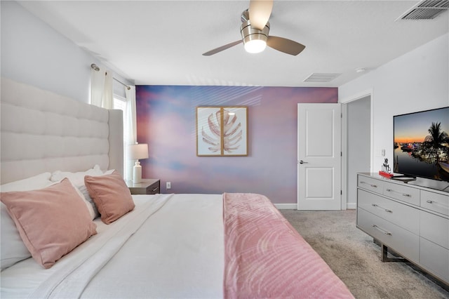 8961 Cabot Cliffs Dr, Davenport, FL 33896 - bedroom with light carpet, a ceiling fan, and baseboards