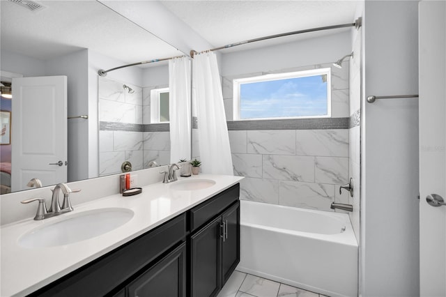 8961 Cabot Cliffs Dr, Davenport, FL 33896 - full bath with shower / tub combo, double vanity, and marble look tile flooring