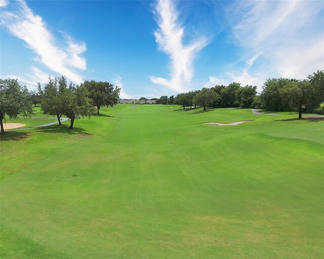 8961 Cabot Cliffs Dr, Davenport, FL 33896 - view of home's community featuring view of golf course and a lawn