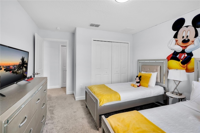 8961 Cabot Cliffs Dr, Davenport, FL 33896 - bedroom with light carpet, baseboards, and a closet