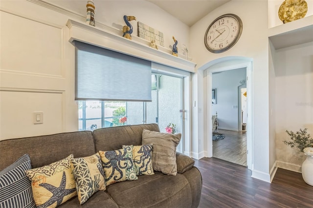 6935 Runner Oak Dr, Wesley Chapel, FL 33545 - living area featuring dark wood-style flooring and arched walkways