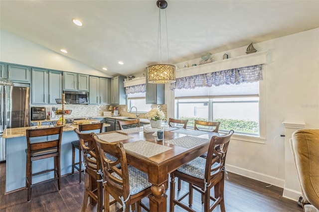 6935 Runner Oak Dr, Wesley Chapel, FL 33545 - dining room featuring dark wood finished floors, lofted ceiling, and recessed lighting