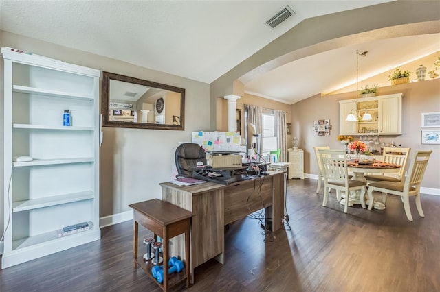 6935 Runner Oak Dr, Wesley Chapel, FL 33545 - home office featuring vaulted ceiling, dark wood-type flooring, decorative columns, and arched walkways