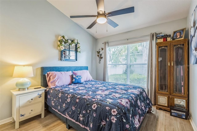 6935 Runner Oak Dr, Wesley Chapel, FL 33545 - bedroom with light wood finished floors, lofted ceiling, and ceiling fan