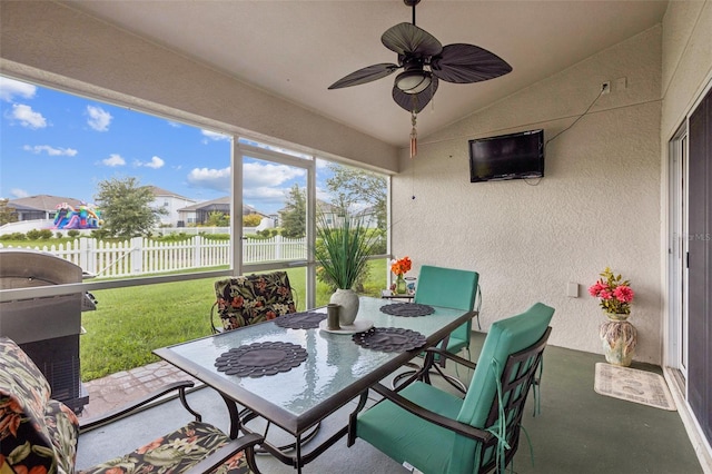 6935 Runner Oak Dr, Wesley Chapel, FL 33545 - sunroom / solarium with outdoor dining area, lofted ceiling, ceiling fan, and a residential view