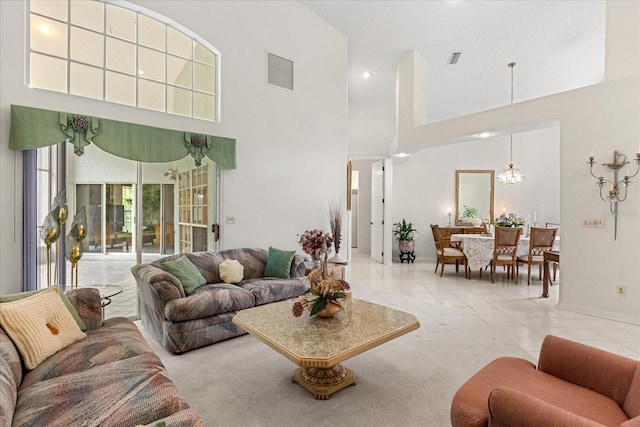4026 S Lake Orlando Pkwy, Orlando, FL 32808 - tiled living room with a towering ceiling, baseboards, recessed lighting, and a chandelier