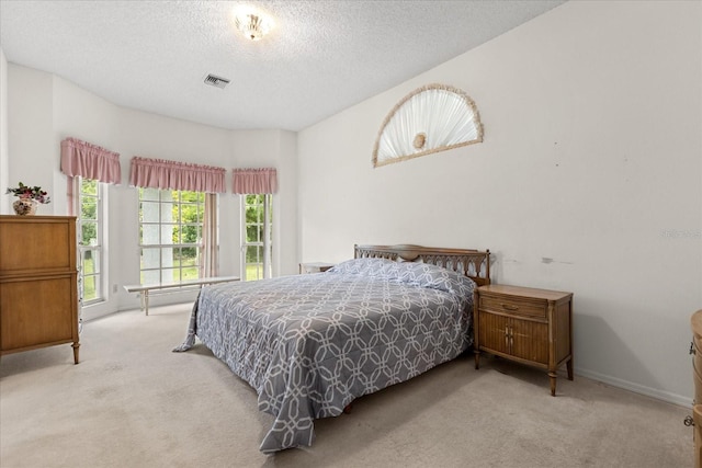 4026 S Lake Orlando Pkwy, Orlando, FL 32808 - carpeted bedroom featuring a textured ceiling and baseboards