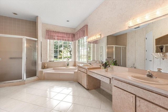 4026 S Lake Orlando Pkwy, Orlando, FL 32808 - full bathroom featuring double vanity, a shower stall, a bath, wallpapered walls, and tile patterned flooring