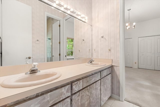 4026 S Lake Orlando Pkwy, Orlando, FL 32808 - bathroom featuring double vanity, tile patterned flooring, and a chandelier