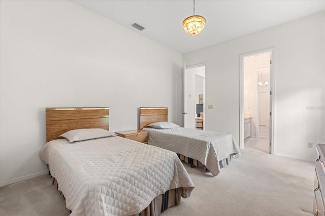 4026 S Lake Orlando Pkwy, Orlando, FL 32808 - bedroom with light carpet, baseboards, and ensuite bath