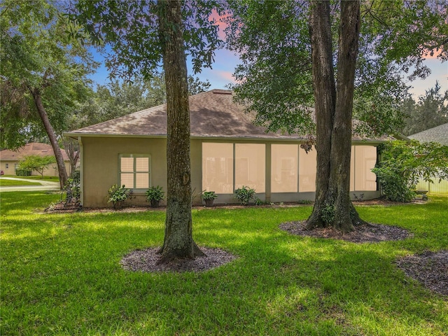 1701 Lucky Pennie Way, Apopka, FL 32712 - view of front of home featuring a front yard, stucco siding, and roof with shingles
