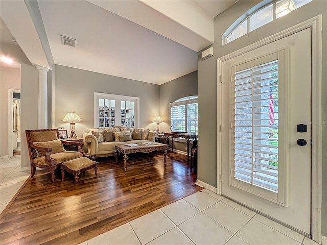 1701 Lucky Pennie Way, Apopka, FL 32712 - living area with light tile patterned floors, decorative columns, and baseboards