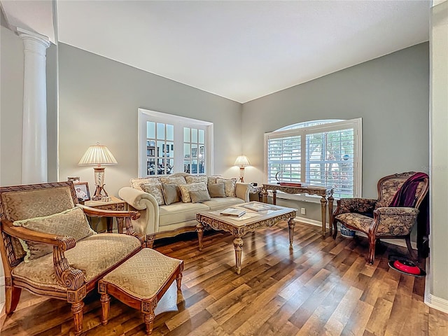 1701 Lucky Pennie Way, Apopka, FL 32712 - living room with ornate columns, wood finished floors, and baseboards