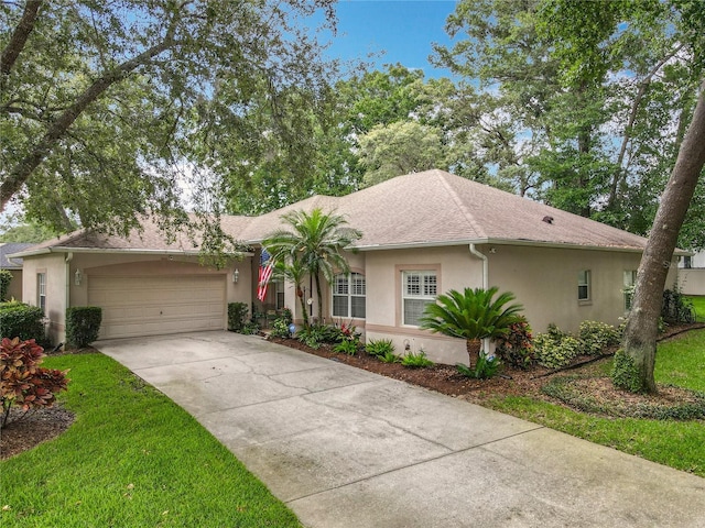 1701 Lucky Pennie Way, Apopka, FL 32712 - ranch-style house featuring stucco siding, driveway, an attached garage, and roof with shingles