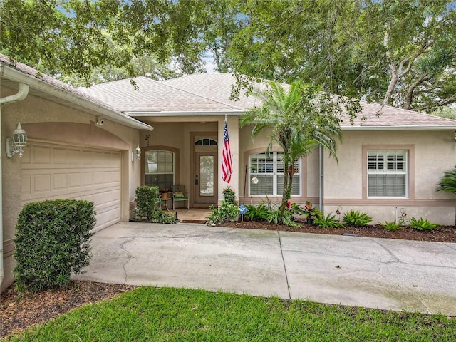 1701 Lucky Pennie Way, Apopka, FL 32712 - single story home with roof with shingles, stucco siding, driveway, and an attached garage