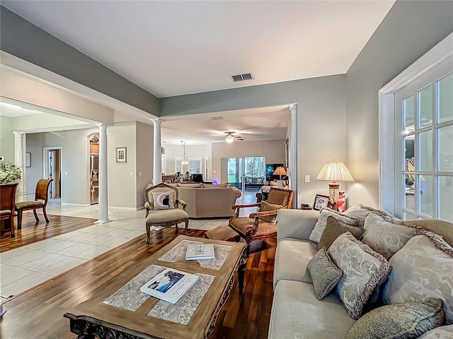 1701 Lucky Pennie Way, Apopka, FL 32712 - living room with decorative columns and light wood-type flooring