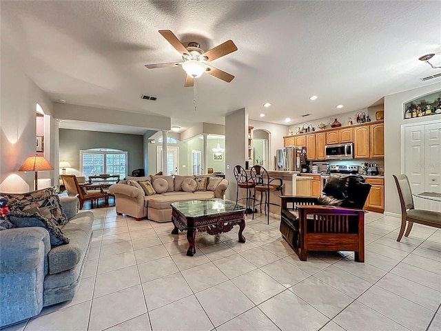1701 Lucky Pennie Way, Apopka, FL 32712 - living room featuring ceiling fan, light tile patterned floors, a textured ceiling, and recessed lighting