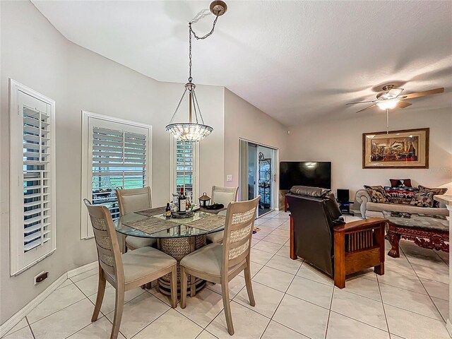 1701 Lucky Pennie Way, Apopka, FL 32712 - dining space featuring a chandelier, light tile patterned floors, lofted ceiling, ceiling fan, and baseboards