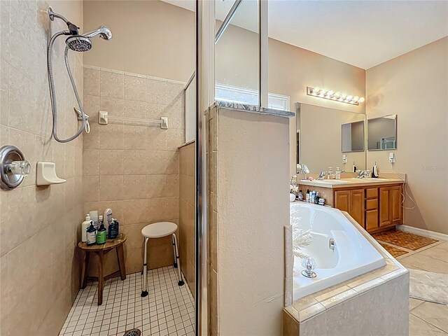 1701 Lucky Pennie Way, Apopka, FL 32712 - bathroom with tiled shower, tile patterned flooring, vanity, and a garden tub