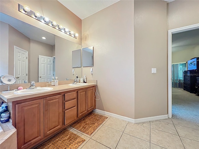 1701 Lucky Pennie Way, Apopka, FL 32712 - bathroom with double vanity, tile patterned flooring, and baseboards