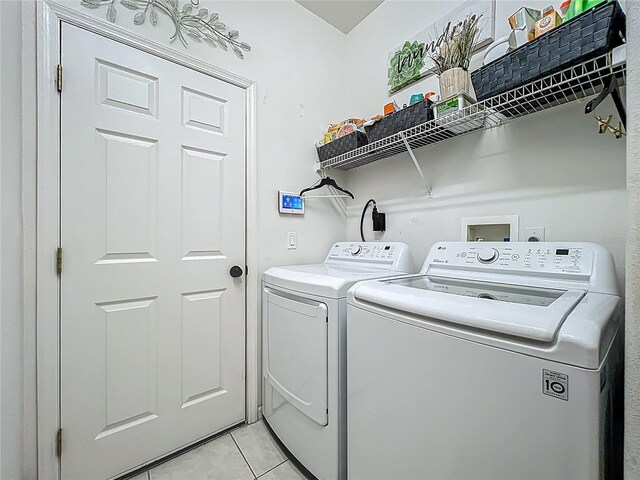 1701 Lucky Pennie Way, Apopka, FL 32712 - laundry room featuring separate washer and dryer and light tile patterned flooring