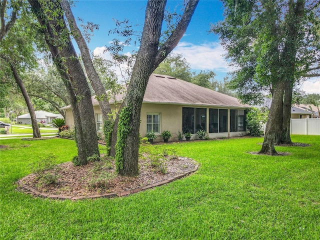 1701 Lucky Pennie Way, Apopka, FL 32712 - rear view of property featuring stucco siding and a sunroom
