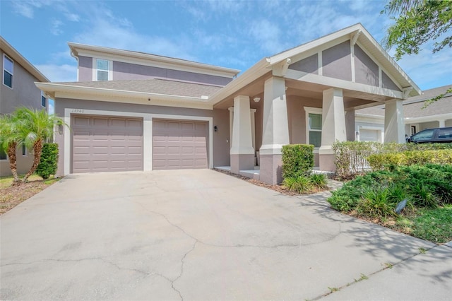 13940 Magnolia Ridge Loop, Winter Garden, FL 34787 - view of front of property featuring stucco siding, a garage, and driveway
