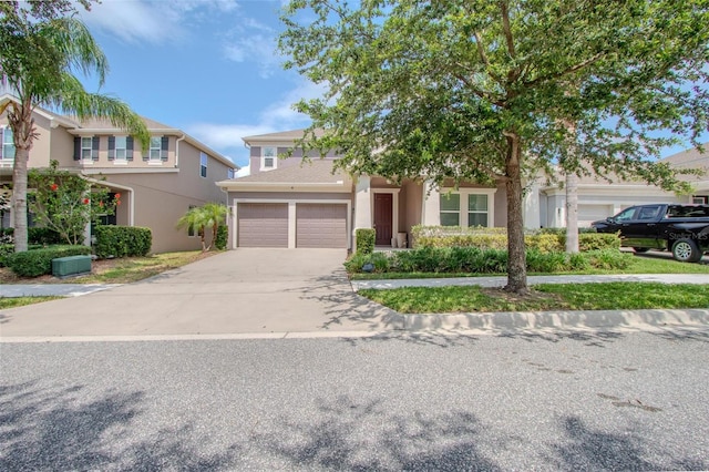 13940 Magnolia Ridge Loop, Winter Garden, FL 34787 - view of property hidden behind natural elements with driveway and stucco siding