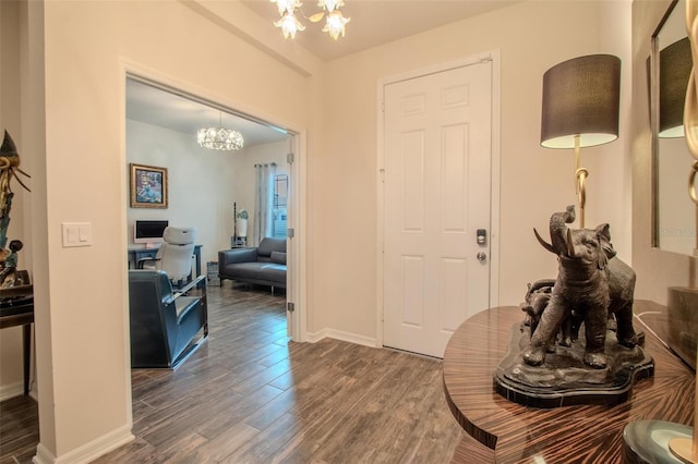 13940 Magnolia Ridge Loop, Winter Garden, FL 34787 - entrance foyer featuring a chandelier, wood finished floors, and baseboards
