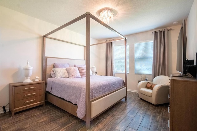 13940 Magnolia Ridge Loop, Winter Garden, FL 34787 - bedroom with dark wood-type flooring, a chandelier, and baseboards