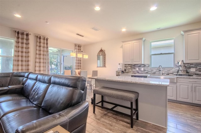 13940 Magnolia Ridge Loop, Winter Garden, FL 34787 - living room with healthy amount of natural light, light wood finished floors, and recessed lighting