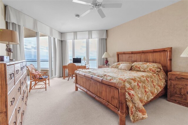 3010 Grand Bay Blvd Unit 472, Longboat Key, FL 34228 - bedroom with light colored carpet, a ceiling fan, and a desk
