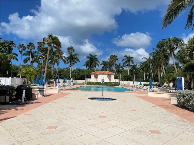 3010 Grand Bay Blvd Unit 472, Longboat Key, FL 34228 - community pool with a patio area and grilling area