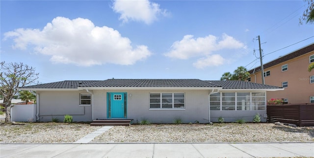 3528 Casablanca Ave, Saint Petersburg, FL 33706 - ranch-style house featuring a sunroom, brick siding, and a tile roof