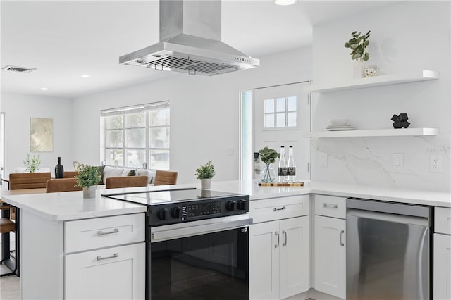 3528 Casablanca Ave, Saint Petersburg, FL 33706 - kitchen featuring black electric range, dishwasher, island exhaust hood, open shelves, and a peninsula