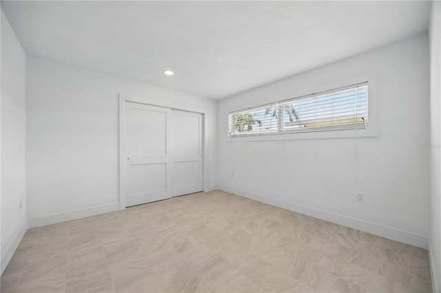 3528 Casablanca Ave, Saint Petersburg, FL 33706 - unfurnished bedroom featuring recessed lighting, baseboards, a closet, and light flooring