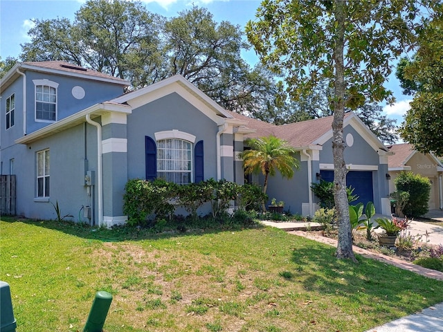 2474 Cimmaron Ash Way, Apopka, FL 32703 - view of front of property featuring an attached garage, a front lawn, and stucco siding