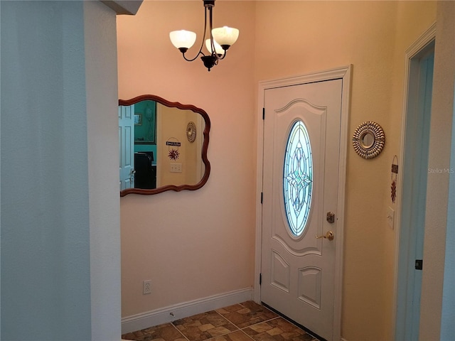 2474 Cimmaron Ash Way, Apopka, FL 32703 - foyer entrance with baseboards and a chandelier