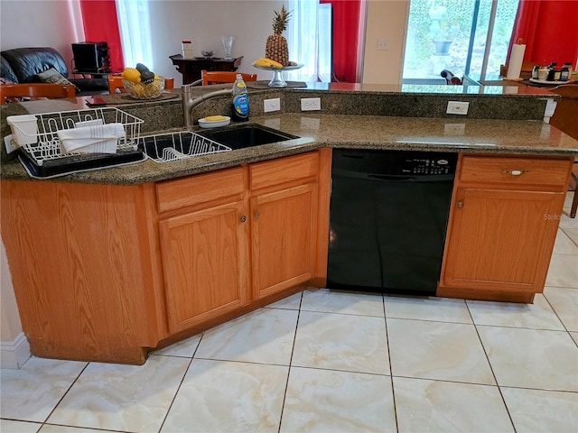 2474 Cimmaron Ash Way, Apopka, FL 32703 - kitchen with black dishwasher, dark stone counters, and light tile patterned floors