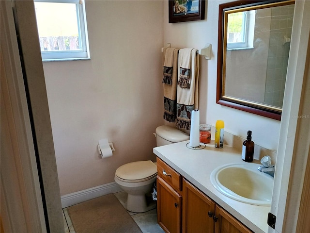 2474 Cimmaron Ash Way, Apopka, FL 32703 - bathroom with toilet, vanity, tile patterned floors, and baseboards