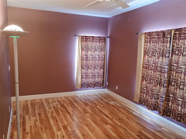 2474 Cimmaron Ash Way, Apopka, FL 32703 - unfurnished room featuring a ceiling fan, wood finished floors, and baseboards