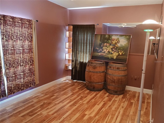 2474 Cimmaron Ash Way, Apopka, FL 32703 - empty room with wood finished floors and baseboards