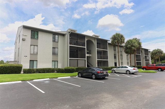 1221 S Pine Ridge Cir Unit A2, Sanford, FL 32773 - view of apartment building / complex with uncovered parking