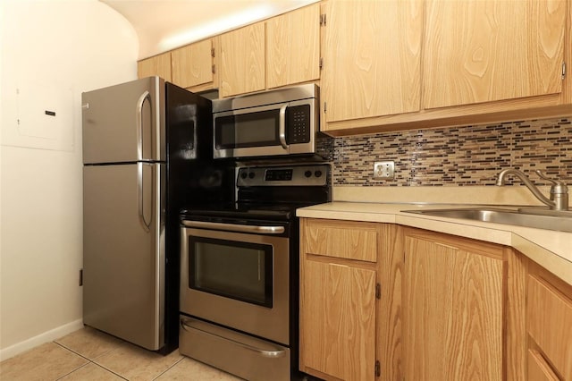 1221 S Pine Ridge Cir Unit A2, Sanford, FL 32773 - kitchen featuring stainless steel appliances, light brown cabinetry, and light countertops