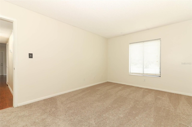 1221 S Pine Ridge Cir Unit A2, Sanford, FL 32773 - unfurnished room with light carpet and baseboards