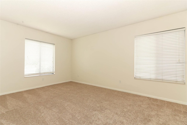 1221 S Pine Ridge Cir Unit A2, Sanford, FL 32773 - spare room with carpet and baseboards
