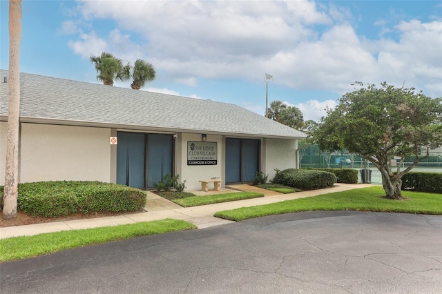 1221 S Pine Ridge Cir Unit A2, Sanford, FL 32773 - view of front of property with stucco siding and roof with shingles